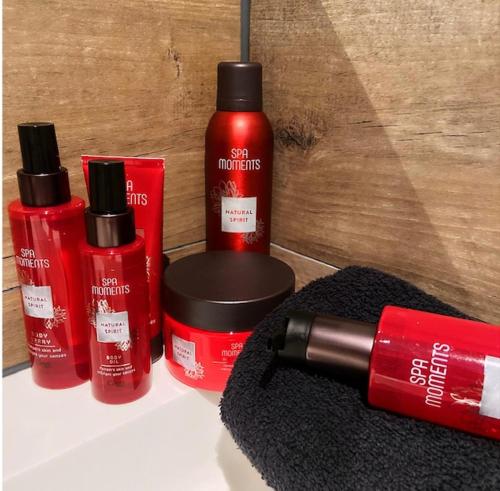 a group of three bottles of red lipstick on a counter at Het Blij Hoen in Oudenbosch