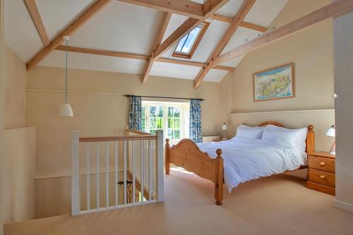 a bedroom with a bed and a window at Finest Retreats - The Laundry Cottage in Newquay