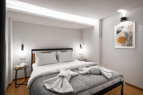 Postel nebo postele na pokoji v ubytování Traveleclectic Apartments