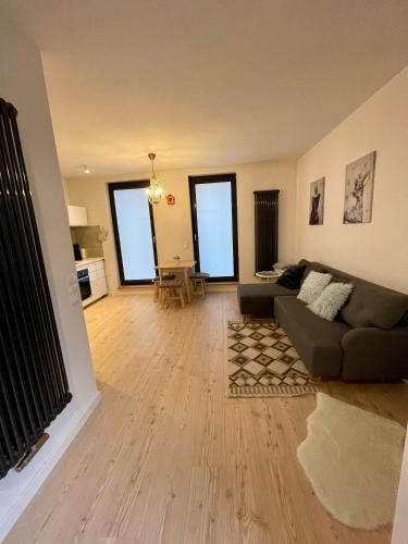 a living room with a couch and a table at Niezapominajek in Opole