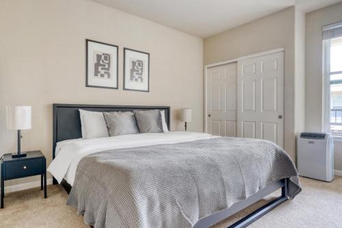 a bedroom with a large bed and a door at San Bruno 1BR w Pool Gym WD nr highways SFO-996 in San Bruno