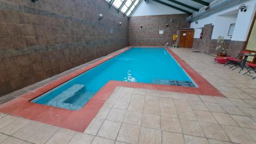 an empty swimming pool in a building at Hotel Diego de Almagro Punta Arenas in Punta Arenas