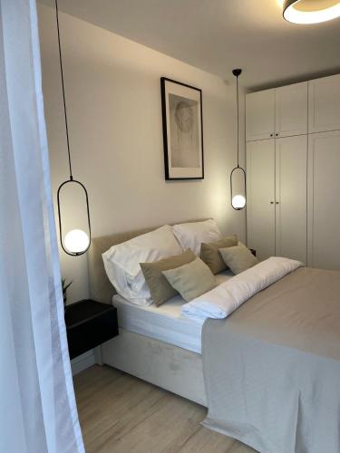 Ένα ή περισσότερα κρεβάτια σε δωμάτιο στο Apartament & Spa Dziwnów