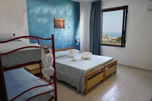 Postel nebo postele na pokoji v ubytování Albergo Marla