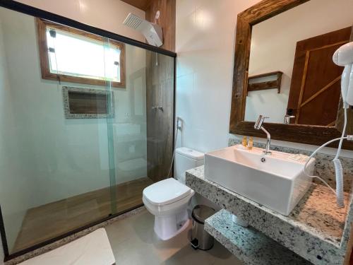 a bathroom with a sink and a toilet at Minha Glória Hotel Boutique in Bom Jardim