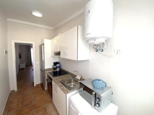 A kitchen or kitchenette at Adeje beach apartament + Parking
