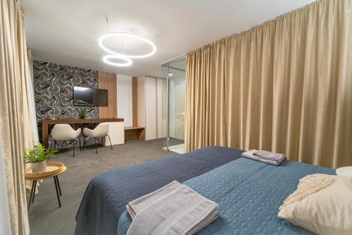 Postel nebo postele na pokoji v ubytování Hotel Zemplín
