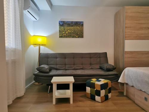 a living room with a couch and a table at Guesthouse Stivan (920) in Štivan