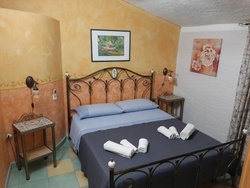 a bedroom with a bed with two towels on it at Casa Vacanze da Giuseppina in Lampedusa