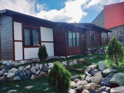 a house with rocks in front of it at Тихият кът in Sapareva Banya