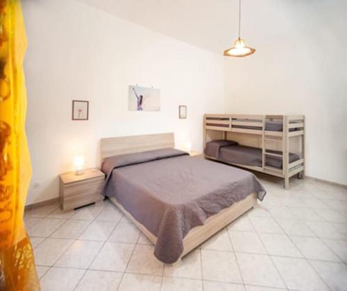 a bedroom with two beds in a room at Casa Tairsia in Torre Lapillo
