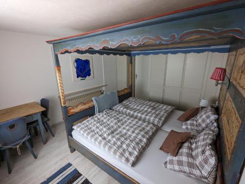 an overhead view of a bedroom with a canopy bed at Haus Edelweiss Jungholz in Jungholz