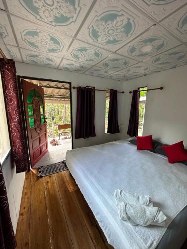 a bedroom with a large bed with a coffered ceiling at Good Time Resort Koh Kood in Ban Lak Uan