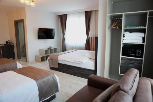 Postel nebo postele na pokoji v ubytování SAR-PER Hotel