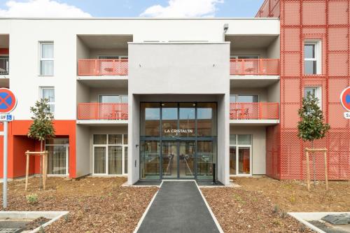 an external view of a building with a glass door at Domitys La Cristal'In in Nancy