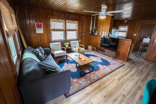 a living room with a couch and a table at Endless Summer in Carolina Beach