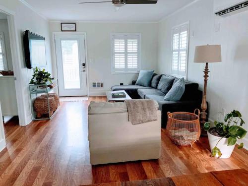 a living room with a couch and a table at Vitamin Sea in Carolina Beach