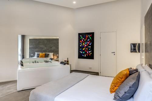 Ένα ή περισσότερα κρεβάτια σε δωμάτιο στο Gallery Suite Naples