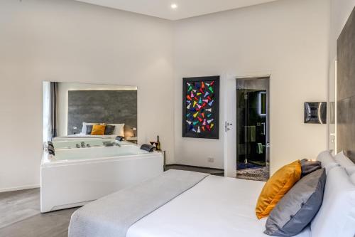 Ένα ή περισσότερα κρεβάτια σε δωμάτιο στο Gallery Suite Naples