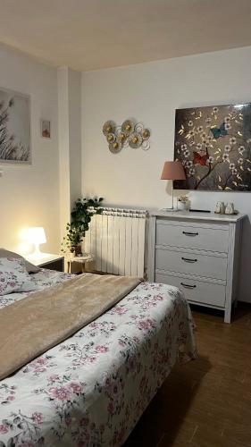 a bedroom with a bed and a dresser at Fiera di Roma B&B in Ponte Galeria