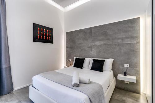 Ένα ή περισσότερα κρεβάτια σε δωμάτιο στο Gallery Suite Naples