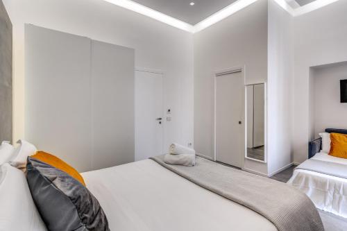 Ένα ή περισσότερα κρεβάτια σε δωμάτιο στο Gallery Suite Naples