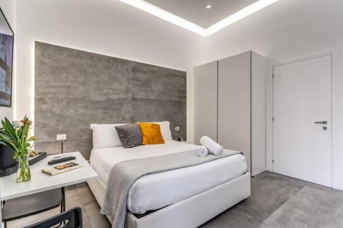 Ένα ή περισσότερα κρεβάτια σε δωμάτιο στο Gallery Suite Naples