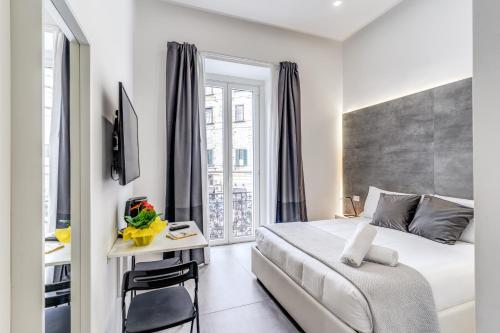 Ένα ή περισσότερα κρεβάτια σε δωμάτιο στο Gallery Suite Naples