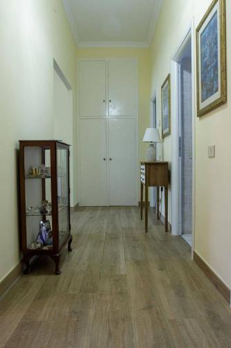 an empty room with a table and a desk at Alloggi Villa Sarsina in Anzio