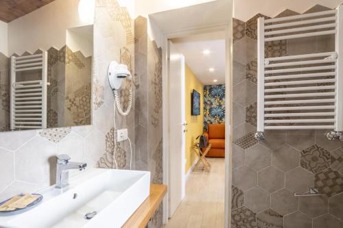 a bathroom with a sink and a mirror at La Casetta a Sorrento in Sorrento