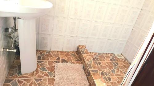 a bathroom with a sink and a toilet at Keelan ace villas in Kampala