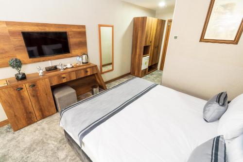 Ένα ή περισσότερα κρεβάτια σε δωμάτιο στο Istanbul Airport Express Hotel