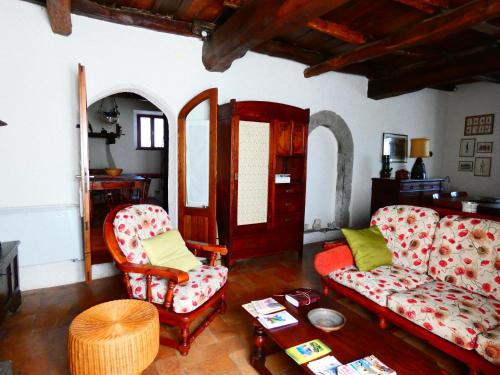 a living room with two couches and a table at La Baronessa Country House in Montefiascone