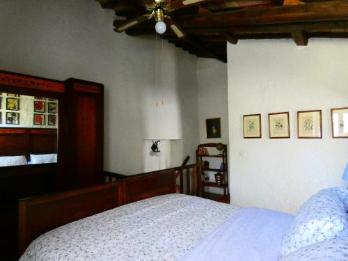 a bedroom with a bed and a ceiling at La Baronessa Country House in Montefiascone