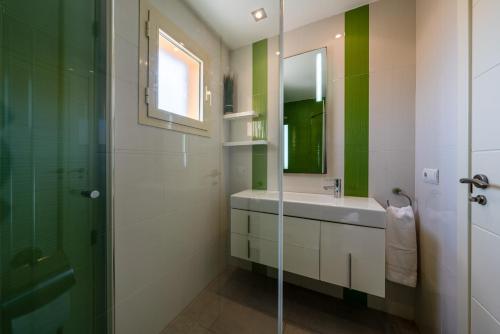 a bathroom with a sink and a mirror at M4R Casa Iuca in Alcudia