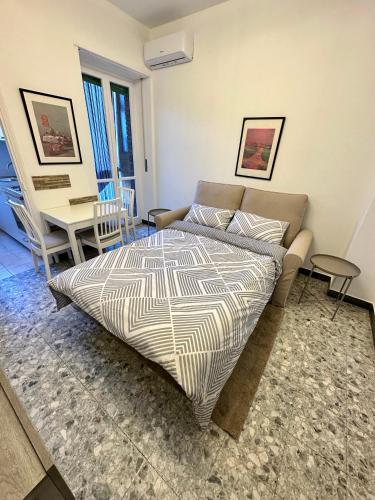 Un pat sau paturi într-o cameră la Casa Sebastopoli - vicino Pala Alpitour