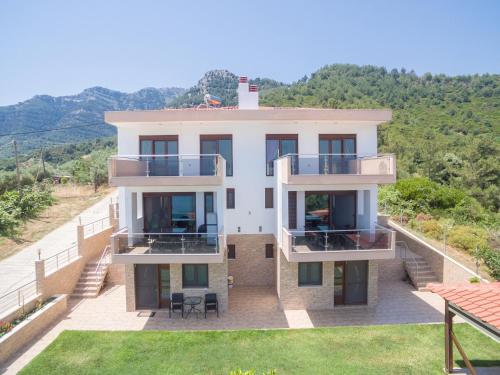 an aerial view of a house with balconies at Vila Mond Sea View Apartments in Kinira