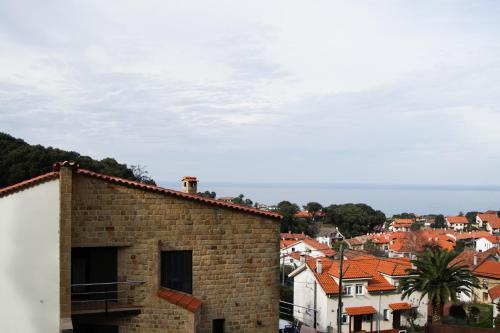a view of a city from a brick building at La Jarocha, casa con vistas al mar en Pechón in Pechón