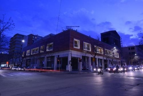a building on the corner of a street at night at Residence Rapisardi by RECEPTIO in Catania