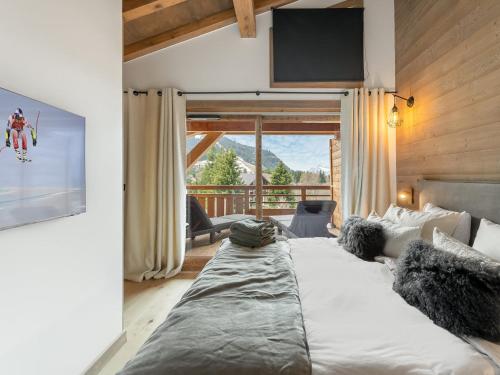 Posteľ alebo postele v izbe v ubytovaní Appartement spacieux avec accès bien-être, proche des pistes et du centre de Megève - FR-1-569-46