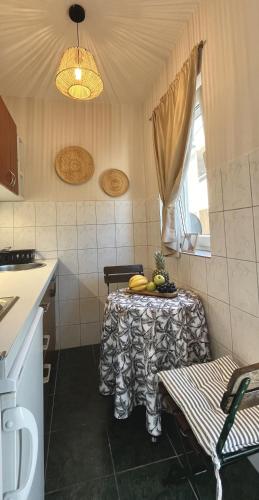 a kitchen with a table with bananas on it at Villa Merci Budva in Budva
