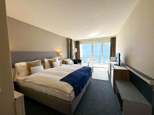 Postel nebo postele na pokoji v ubytování Seehotel Riviera at Lake Lucerne