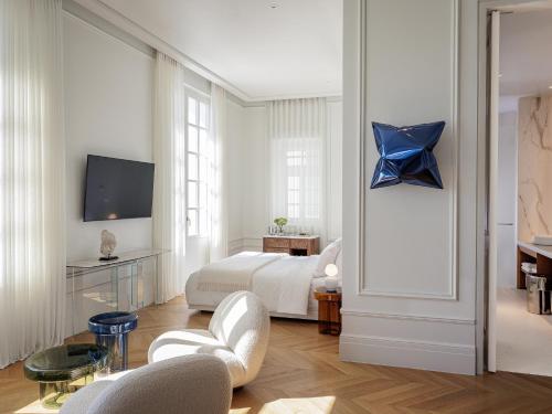 a bedroom with a bed with a blue star on the wall at The Dolli at Acropolis, A Hotel to Live in Athens