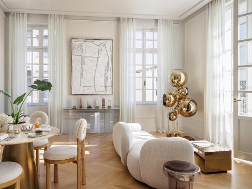 a living room with a couch and a table at The Dolli at Acropolis, A Hotel to Live in Athens