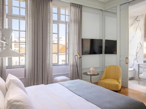 a bedroom with a large bed and a large window at The Dolli at Acropolis, A Hotel to Live in Athens