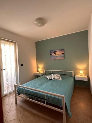 En eller flere senger på et rom på Villetta Gioia