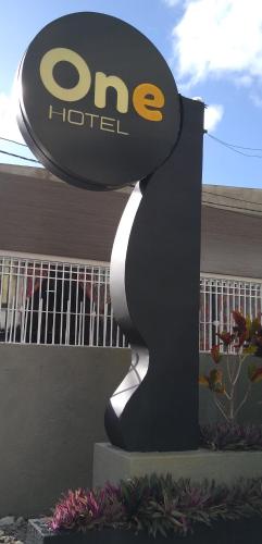 a one hotel sign in front of a building at One Hotel in João Pessoa
