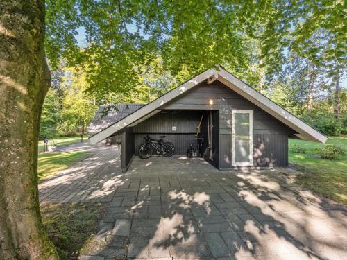 a garage with a bike parked inside of it at Holiday Home Jaakoppi - 25km from the sea by Interhome in Toftlund