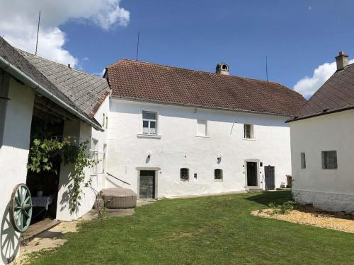 a large white building with a yard in front of it at Holiday Home Kojetice na Moravě by Interhome in Kojetice