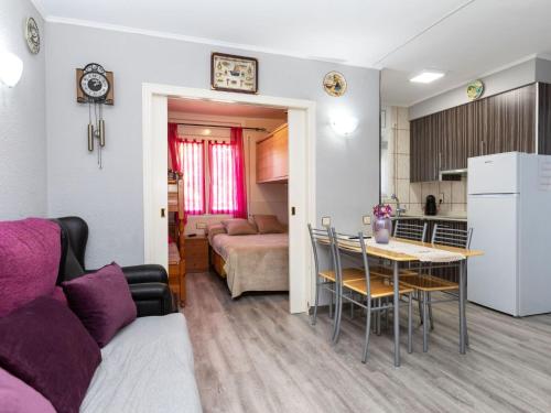 a kitchen and a living room with a table in a room at Holiday Home Eden Park 2 by Interhome in Miami Platja